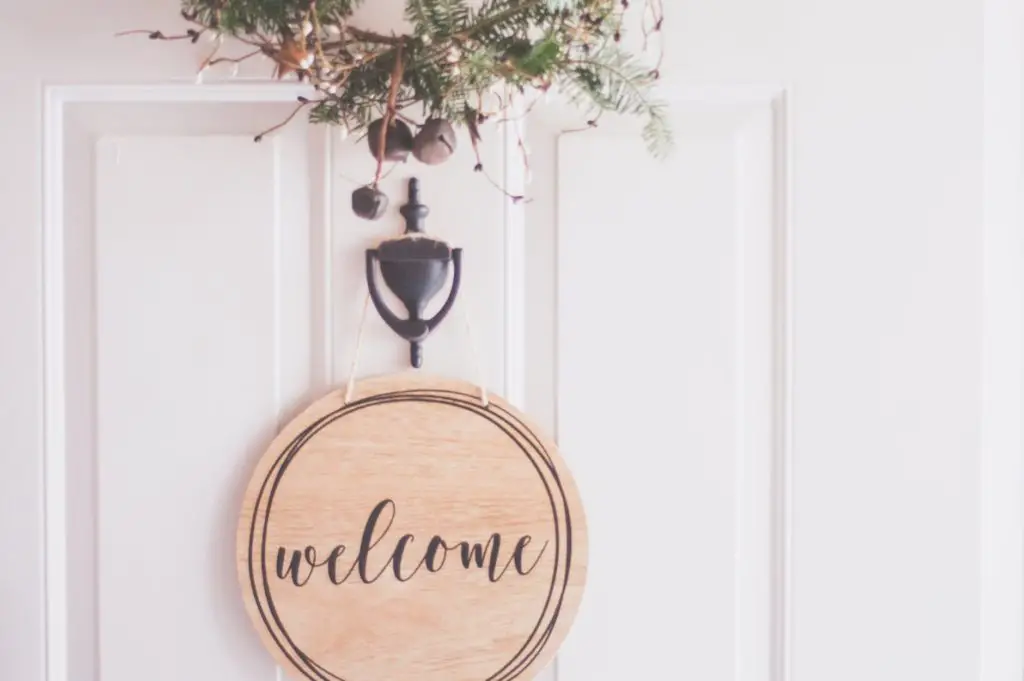 brown wooden welcome wall decor