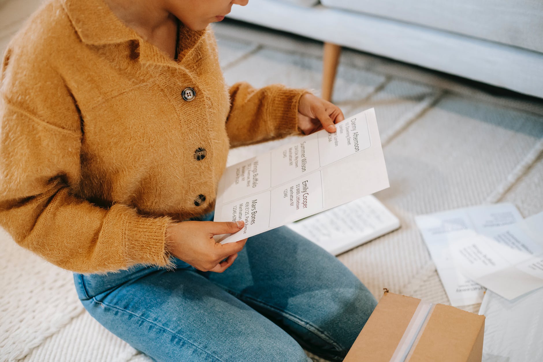 woman in soft stylish cardigan checking information in chart