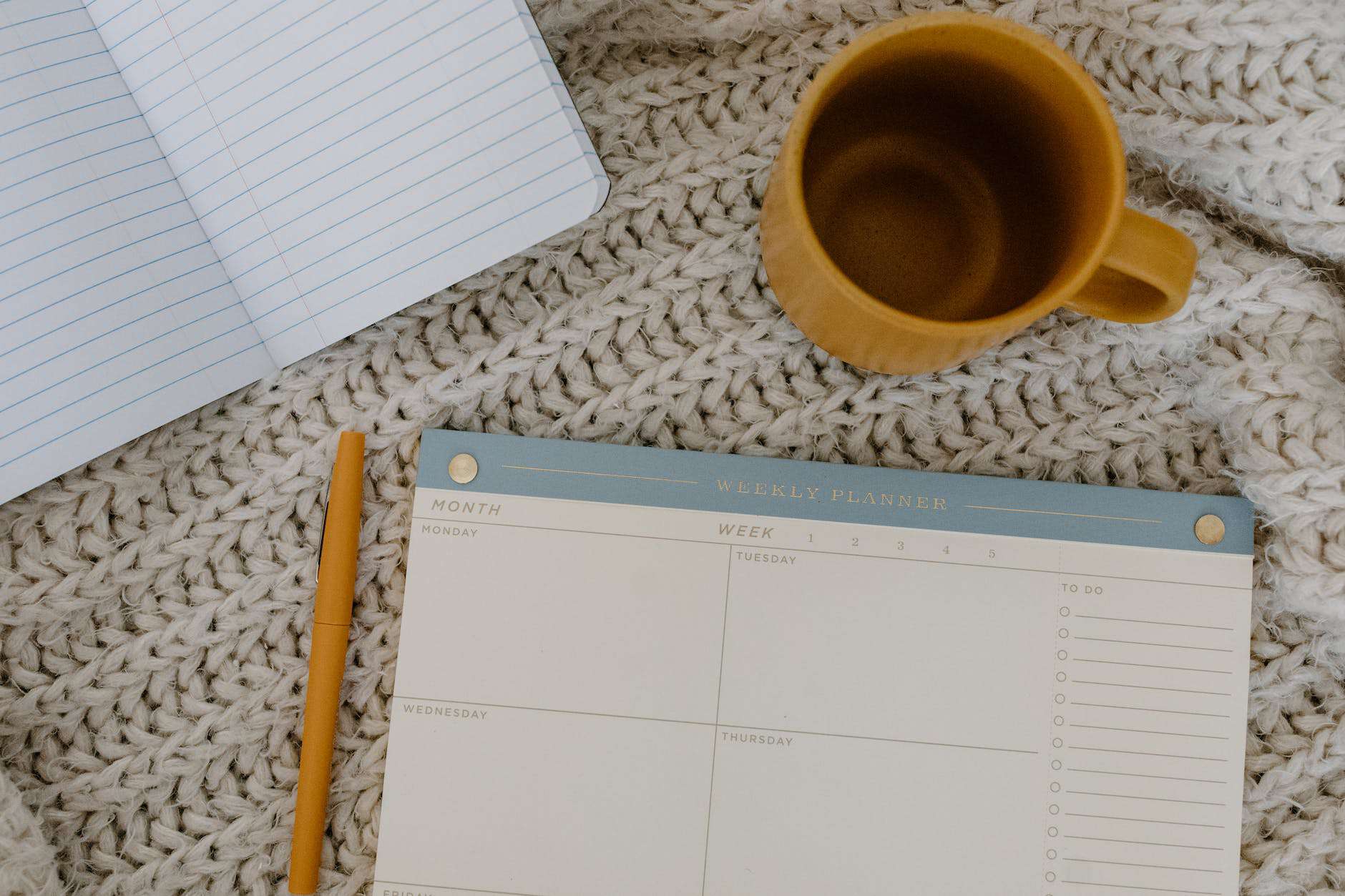 flatlay photo of weekly planner