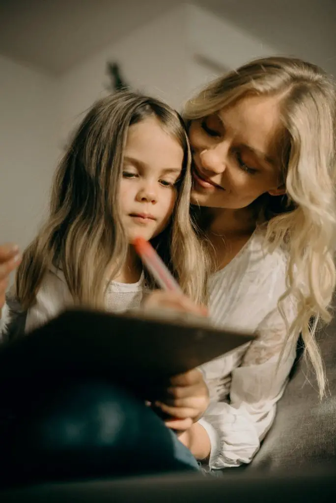 girl writing on the paper photograph