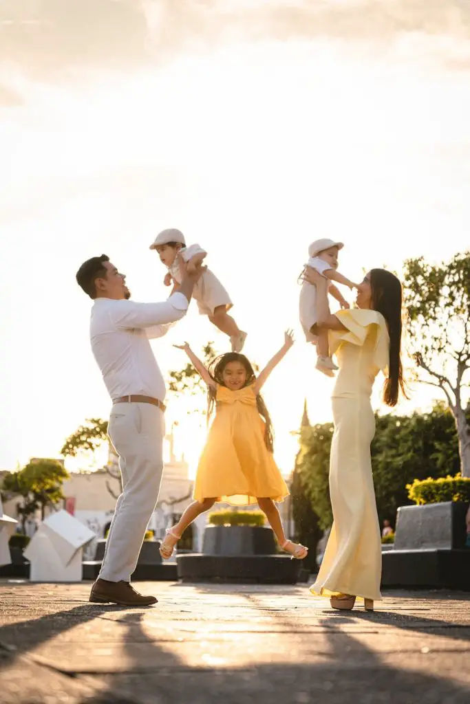 serene family posing in back lit